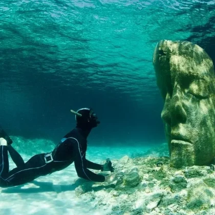 Snorkeling underwater statue Sainte-Marguerite island