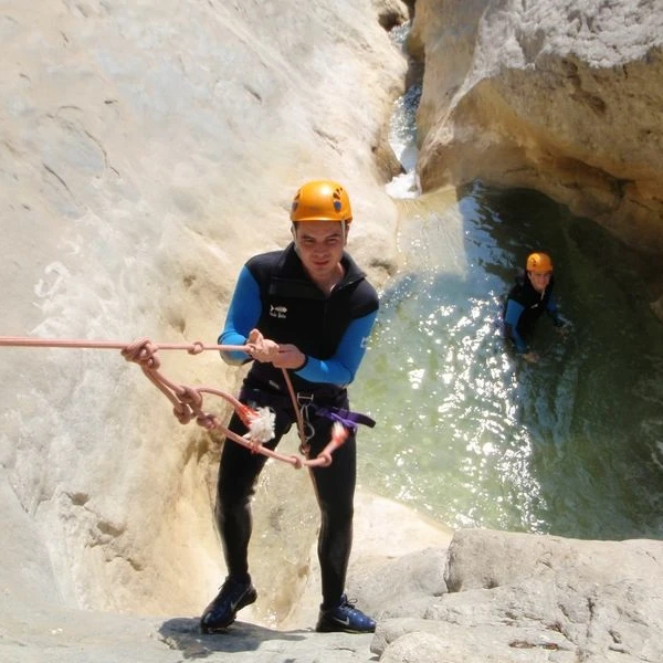rappelling descent in canyoning